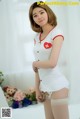 Ye Na hot beauty in nurse-style lingerie (9 photos)