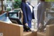 A woman in a business suit standing at a reception desk.